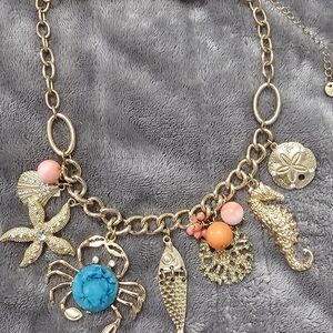 Gold Charm Necklace with Turquoise and Coral Accents